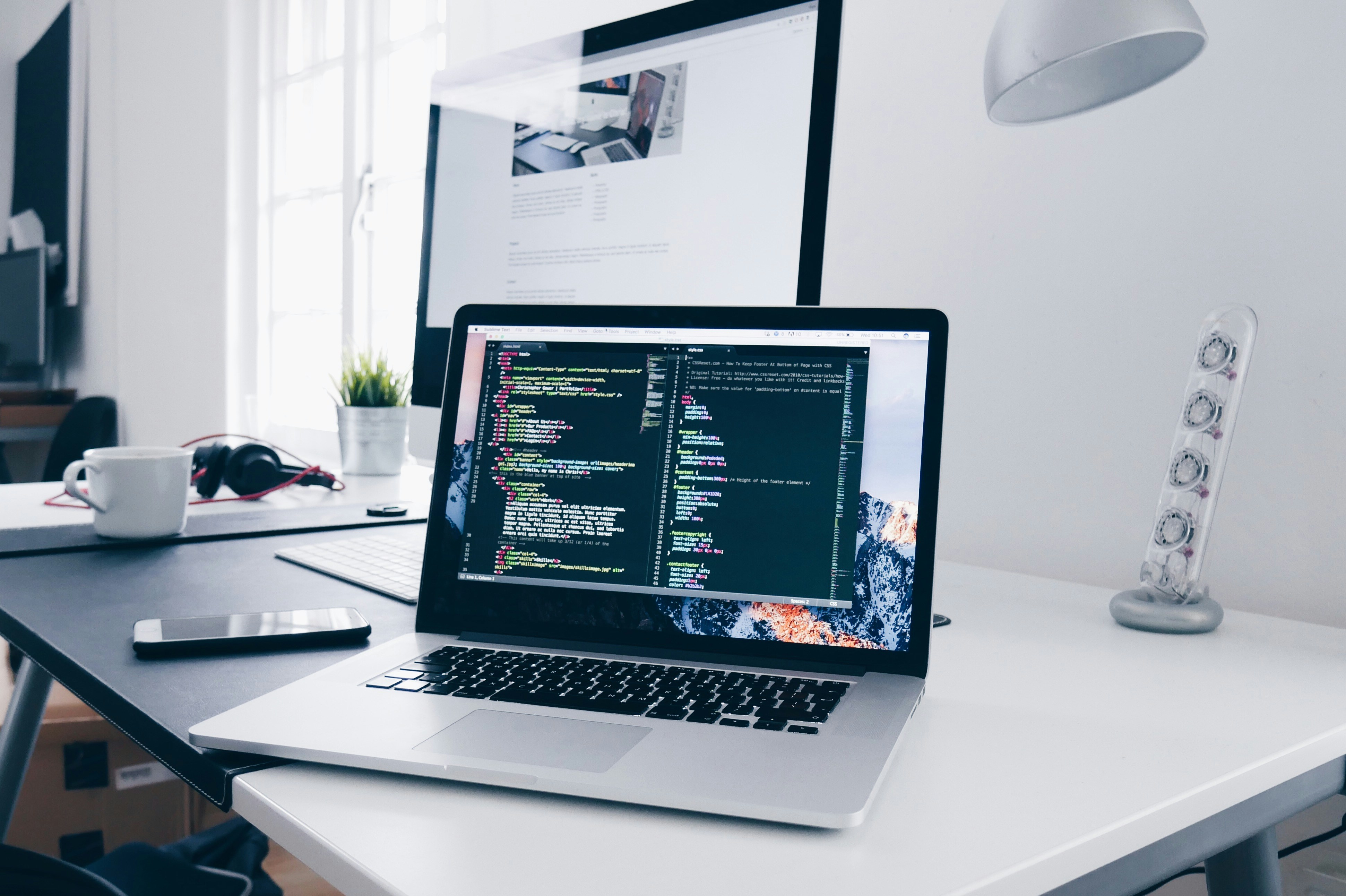 Laptop with code on a desk